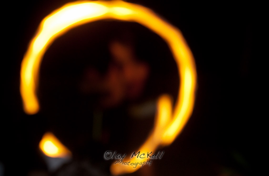 My fave out of all the fire-twirling shots at Kim's wedding was this terribly out-of-focus one.  I really dig the abstractness that just focuses my thoughts on the simple geometry.